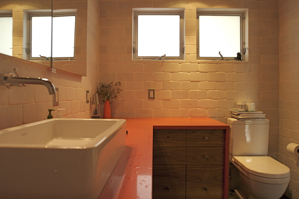 Warm tiled bathroom with custom vanity
