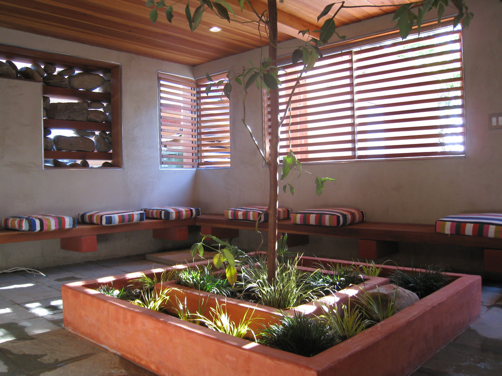 Finished indoor-outdoor room with wood screens and built-in seating