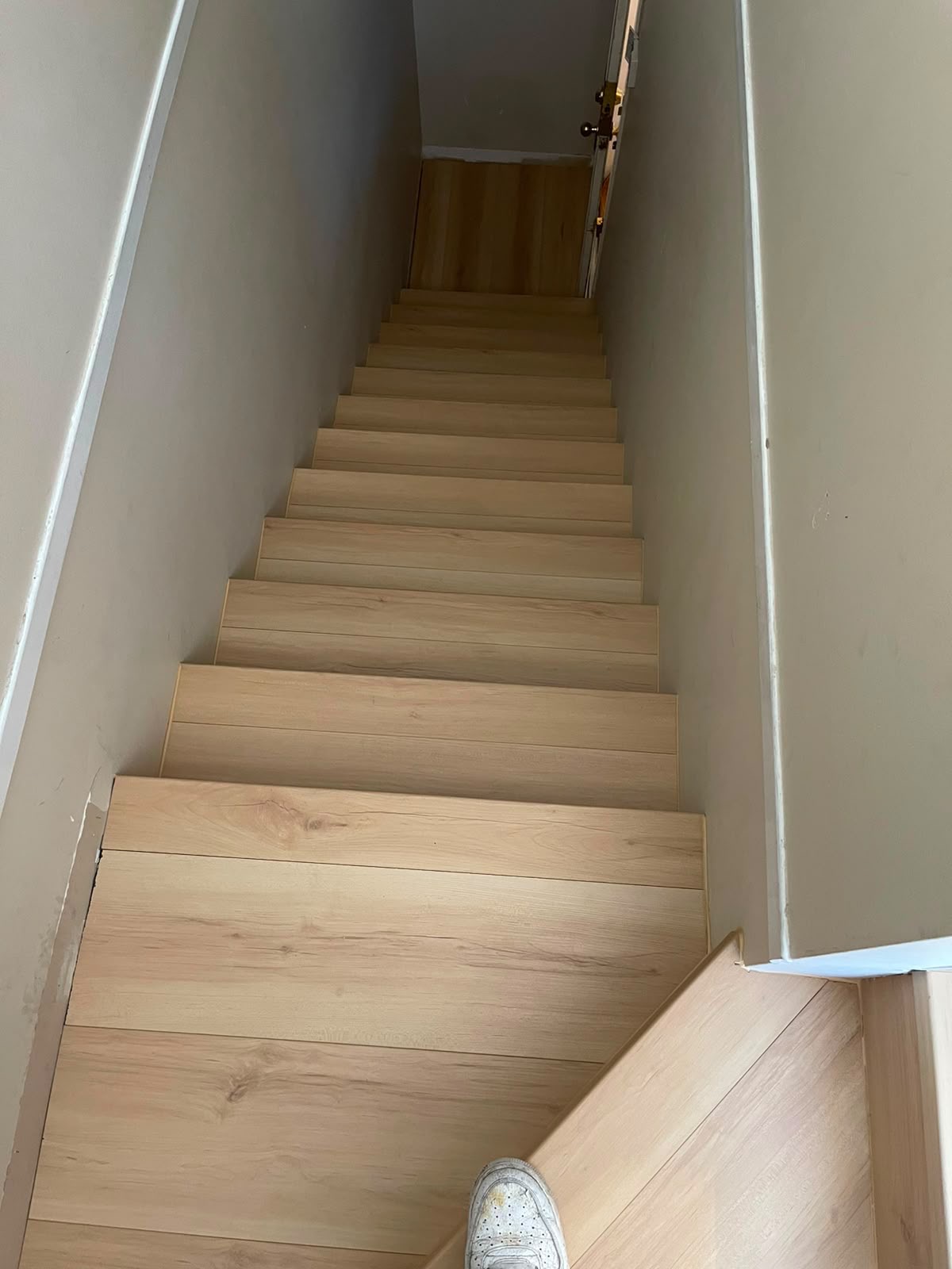 Wood staircase during finishing work